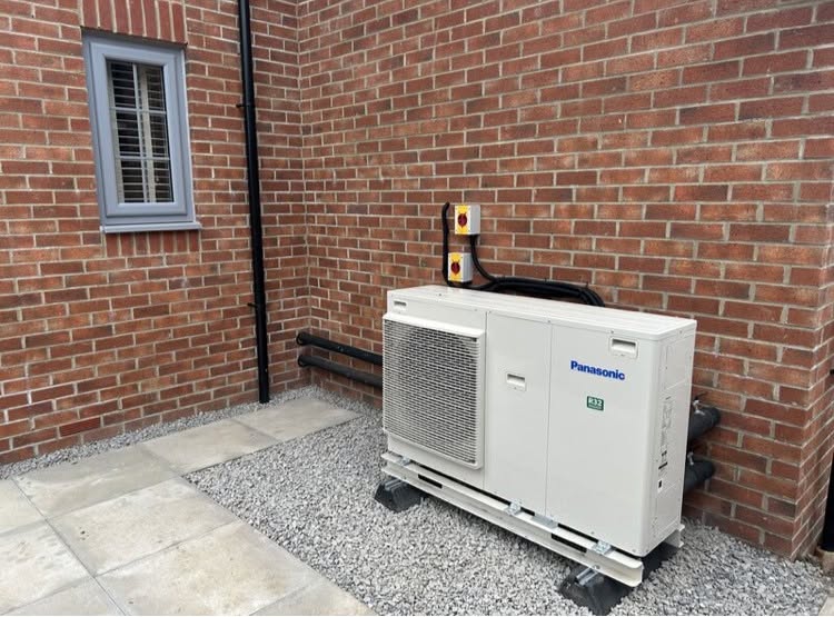 Panasonic heat pump neatly installed at a home